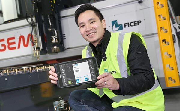 BigChange Ficep employee holds tablet