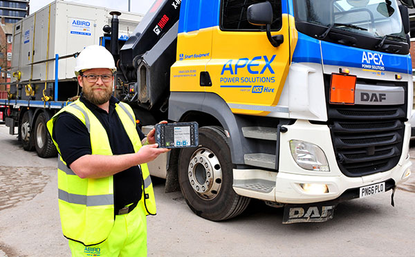 ABird Power Solutions employee holding a JobWatch mobile device