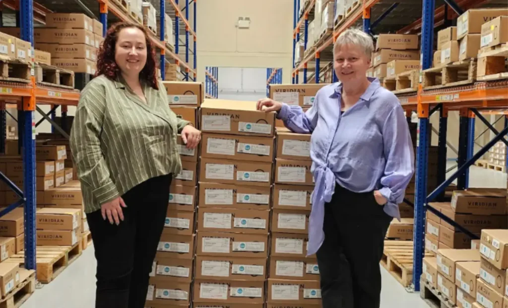Two female entrepreneurs in a warehouse